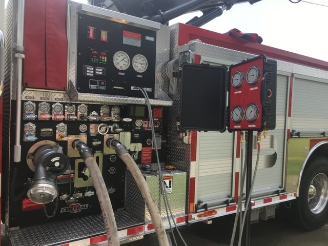 A fire truck with many different types of equipment on it.